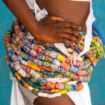 Strands of beautiful Krobo beads adorn the hips of a Dipo initiate (image by Inger Vandyke)