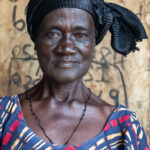 Portrait of Adra. She has spent her life making the fabric paint that adorns Adinkra, one of the traditional cloths of Ghana (image by Inger Vandyke)