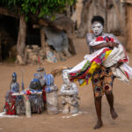 A Gambada devotee twirling past sacred idols (image by Inger Vandyke)