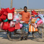 Plastic goods for sale by bike in Bangladesh (image by Inger Vandyke)