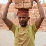 Portrait of a brick carrier (image by Inger Vandyke)