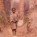 A young girl working in the brick kilns (image by Inger Vandyke)