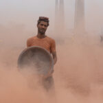 Portrait of a brick worker in the dust of a large brick factory in Dhaka (image by Inger Vandyke)