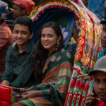 Commuters in a cycle rickshaw in Dhaka (image by Inger Vandyke)