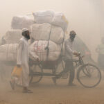 Dust explodes in the streets of Dhaka as the city prepares for the annual onslaught of mosquitoes in the monsoon (image by Inger Vandyke)
