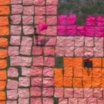 Children working to lay out freshly dyed fabric to dry in the sun (image by Inger Vandyke)