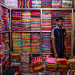 A colourful shop selling locally produced dyed cloths (image by Inger Vandyke)
