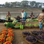 Traders selling vegetables from a beautiful floating market (image by Inger Vandyke)