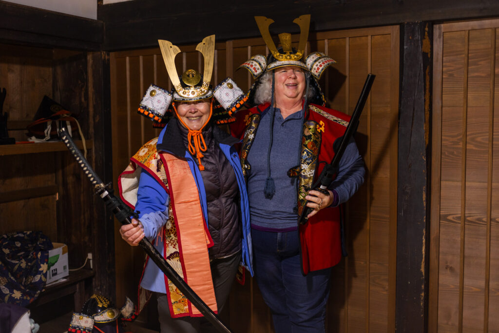 Dressing as Samurai warriors provides some laughs for group members Alla and Deborah! (image by Virginia Wilde)