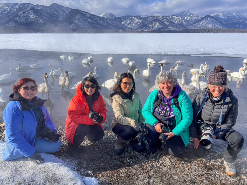A happy tour group, enjoying the Whooper Swans of Lake Kussharo (image by Virginia Wilde)
