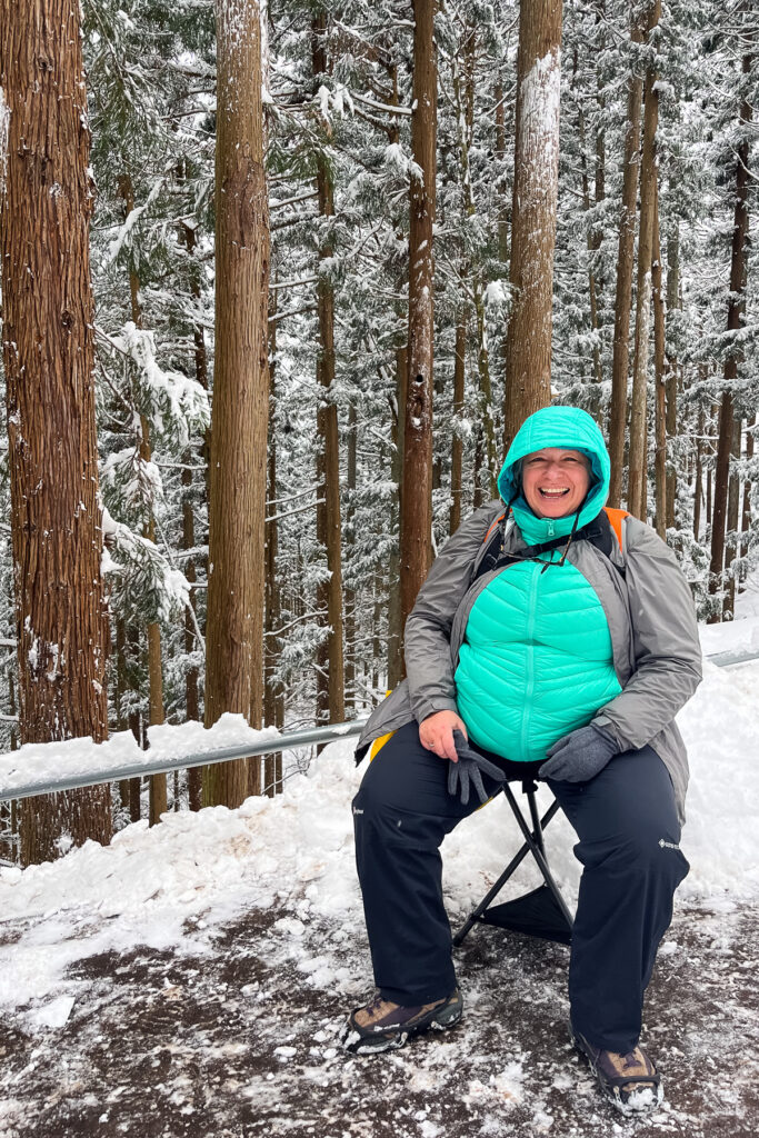 Rimma takes a break while trekking the snowy path to see the Japanese Macaques (Snow Monkeys) (image by Virginia Wilde)