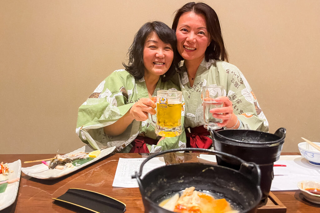 Group members Sasha and Kai enjoy a beer at dinner! (image by Virginia Wilde)