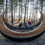 Still made with twisting hardwoods by hand, a Moonboat sits under construction in the she-oaks adjacent to the beach where she will eventually be launched (image by Inger Vandyke)