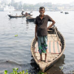 An elderly man who drives one of the river taxi boats in Dhaka (image by Inger Vandyke)