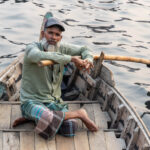 A river taxi captain waiting for his next ride (image by Inger Vandyke)