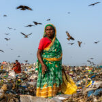 An elderly woman working as a waste picker (image by Inger Vandyke)