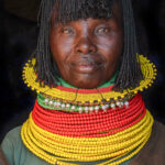A beautiful Turkana woman wearing her full Agoroma necklace. These multi-stranded necklaces can weigh up to 7kg! (image by Inger Vandyke)