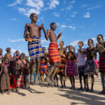 Young Dassanech men dancing at a Micha ceremony (image by Inger Vandyke)
