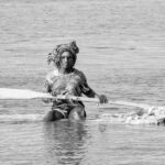 A young El Molo man returns from his community on an island in Lake Turkana (image by Inger Vandyke)