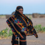 A Gabra woman at sunrise in the Chalbi Desert (image by Inger Vandyke)