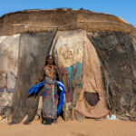 A Gabra woman in the doorway of her old mandasse (image by Inger Vandyke)