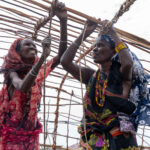 Gabra women building a traditional Mandasse, or Gabra home. It only takes them one day to complete from start to finish! (image by Inger Vandyke)