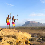 Samburu Morans at sunrise near Mount Ololokwe, part of the Matthews Range in Kenya (image by Inger Vandyke)