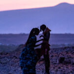 Turkana girls preparing for sunrise at blue hour (image by Inger Vandyke)