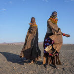 Turkana women dancing in the rock desert (image by Inger Vandyke)