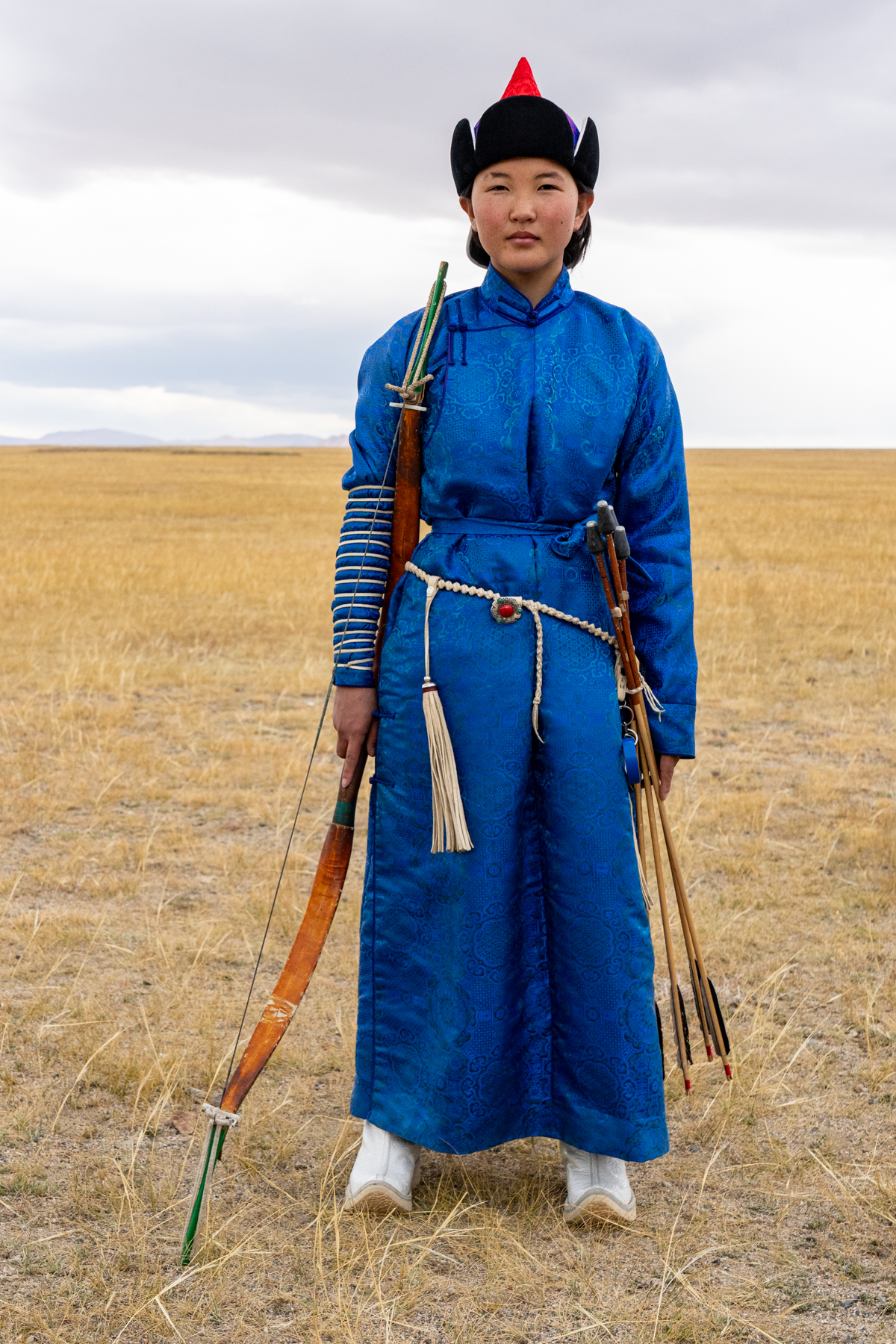 A young girl dressed to compete in the archery competition at the Tolbo Lake Eagle Hunter Festival (image by Inger Vandyke)