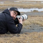 Cristian getting down low for the Magellanic Plover shot (image by Mike Watson)