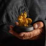 A secondary shaman of the Darkhad, holding a tiny gold shaman sculpture (image by Inger Vandyke)