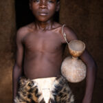 Portrait of a young Dikpantri dancer wearing the skin of an African Civet (image by Ingrid Koedood)