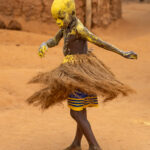Ready to dance, a young Kokou devotee twirls into the ceremony (image by Ingrid Koedood)