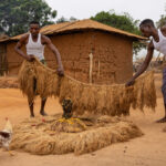 Preparations are made for the Kokou ceremony: rattan skirts, palm oil, white and yellow powder. (image by Ingrid Koedood)