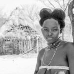 Monochrome portrait of a Nguendelengo woman with her stunning beehive hairstyle (image by Inger Vandyke)