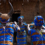 Otamari women singing and dancing a traditional Dikuntri ceremony of women for us in front of a traditional tata (image by Ingrid Koedood)