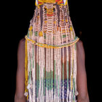 They almost look as amazing from behind as they do from the front. Adornment detail of an Ovahanda woman (image by Inger Vandyke)