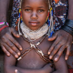 The newest generation of Ovahanda people. This little girl is the youngest we have met of this endangered culture in southern Angola (image by Inger Vandyke)