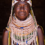 A proud Ovahanda woman wearing her multi-stranded white Vilanda (image by Inger Vandyke)