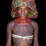 A striking Ovakuvale woman with her large Ompota headdress and Oyonduthi bra (image by Inger Vandyke)