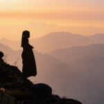 Silhouette of an Ovamwila girl at Tundavala Escarpment, sunset (image by Inger Vandyke)
