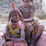 Ovamwila girls doing each others' hair with red ochre at Tundavala (image by Inger Vandyke)