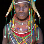 A regal Ovamwila woman with her stunning Nontombe braids and vilanda necklaces (image by Inger Vandyke)