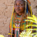 Ovamwila behind the bushes in her compound (image by Inger Vandyke)