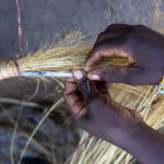 The hands of an Ovandimba woman weaving a grain storage basket (image by Inger Vandyke)