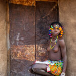 Portrait of a beautiful Ovandimba girl in the doorway of her home (image by Inger Vandyke)