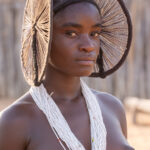 An Ovankhumbi girl with her beautiful spiral hairstyle for her initiation (image by Inger Vandyke)