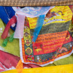 Prayer flags adorning a shamanic Ovoo worship site (image by Inger Vandyke)