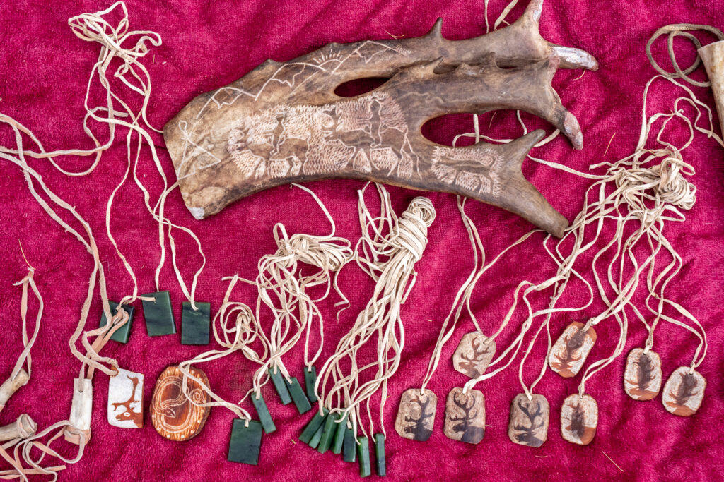 The Tsaatan fashion home made souvenirs from reindeer antlers and local green stone (image by Inger Vandyke)